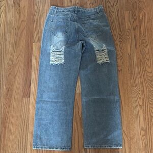 Woman’s super cute baggy distressed high waisted jeans